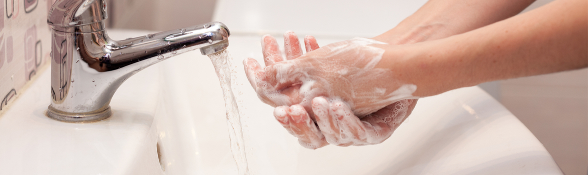 Coronavirus - A woman washing her hands with soap and warm water to help stop the spread of the coronavirus.